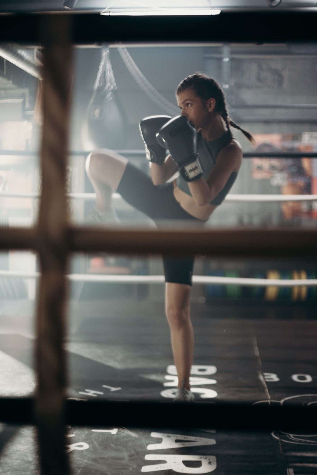 A boxer training in the ring with gloves up.